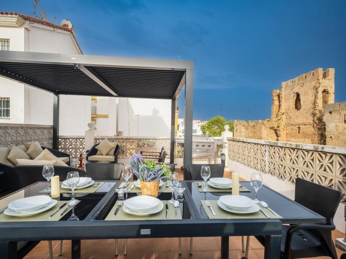Dining area for eight on solarium with sitting area and BBQ