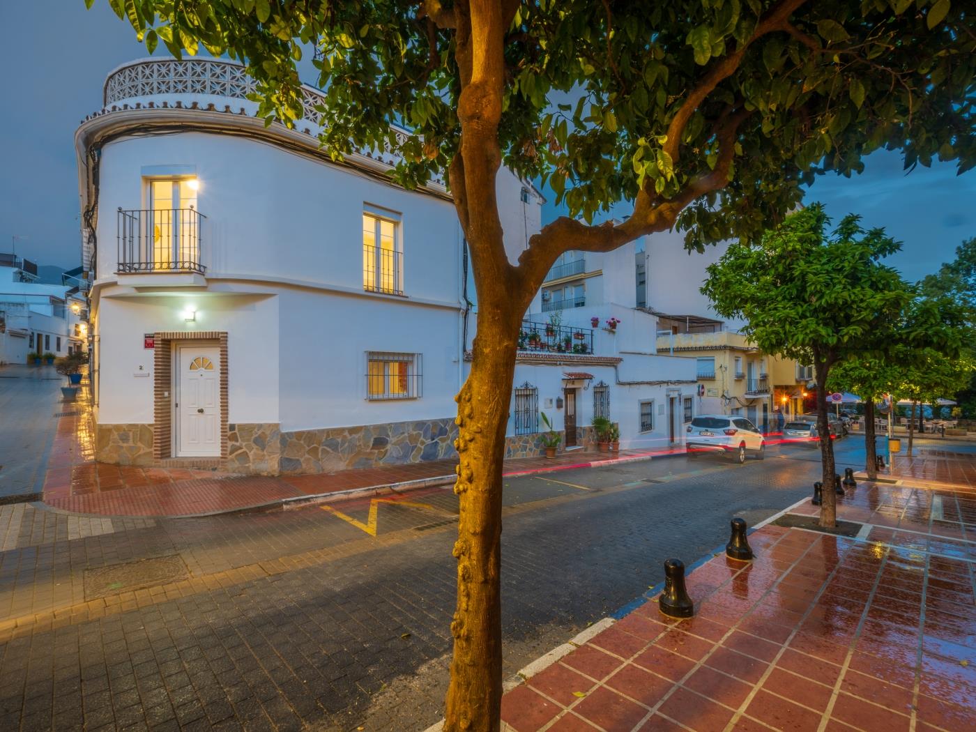 Modern accomodation in the old town of Marbella with cobble stone streets with orange trees