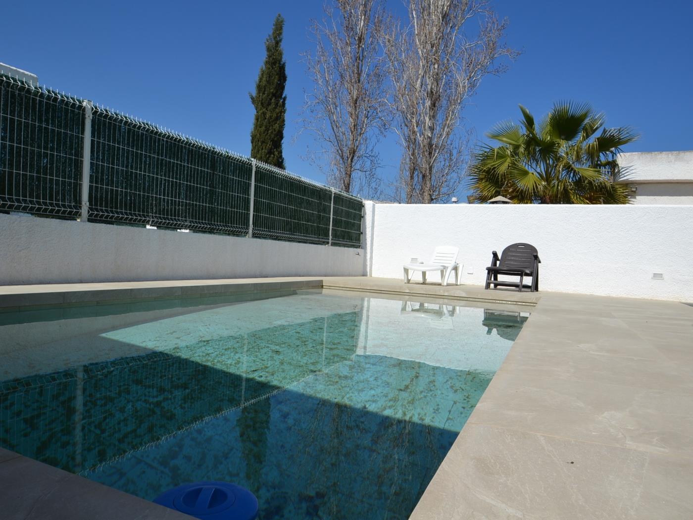 Casa Blanca amb piscina privada en Riumar, Costa Dorada a RIUMAR-DELTEBRE